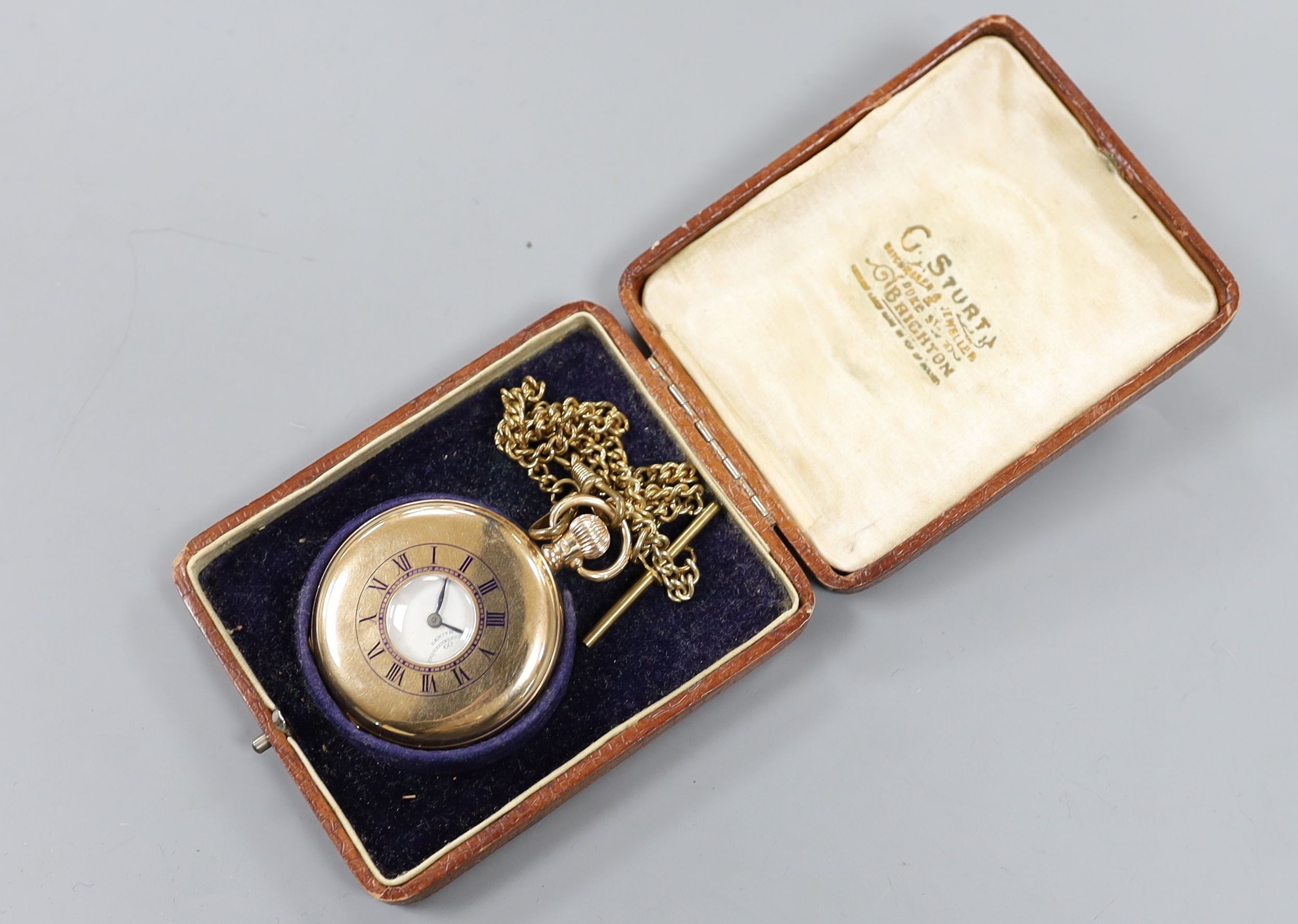 A George V 9ct gold half hunter keyless Zenith pocket watch, case diameter 50mm, gross 99 grams, with a gilt metal albert.